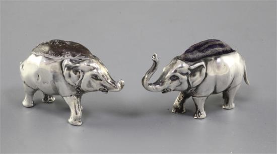 An Edwardian novelty silver pin cushion modelled as an elephant, Levi & Salaman, Birmingham 1906, and one other.